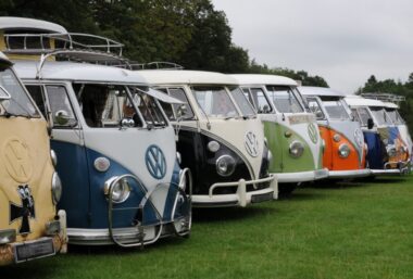 VW Campers in a line in a field for ALA GAP Insurance
