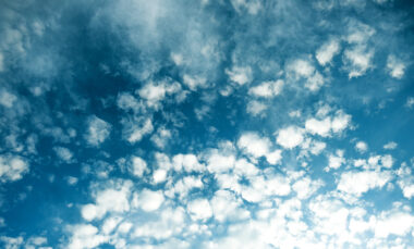 Patchy fluffy clouds in a blue sky