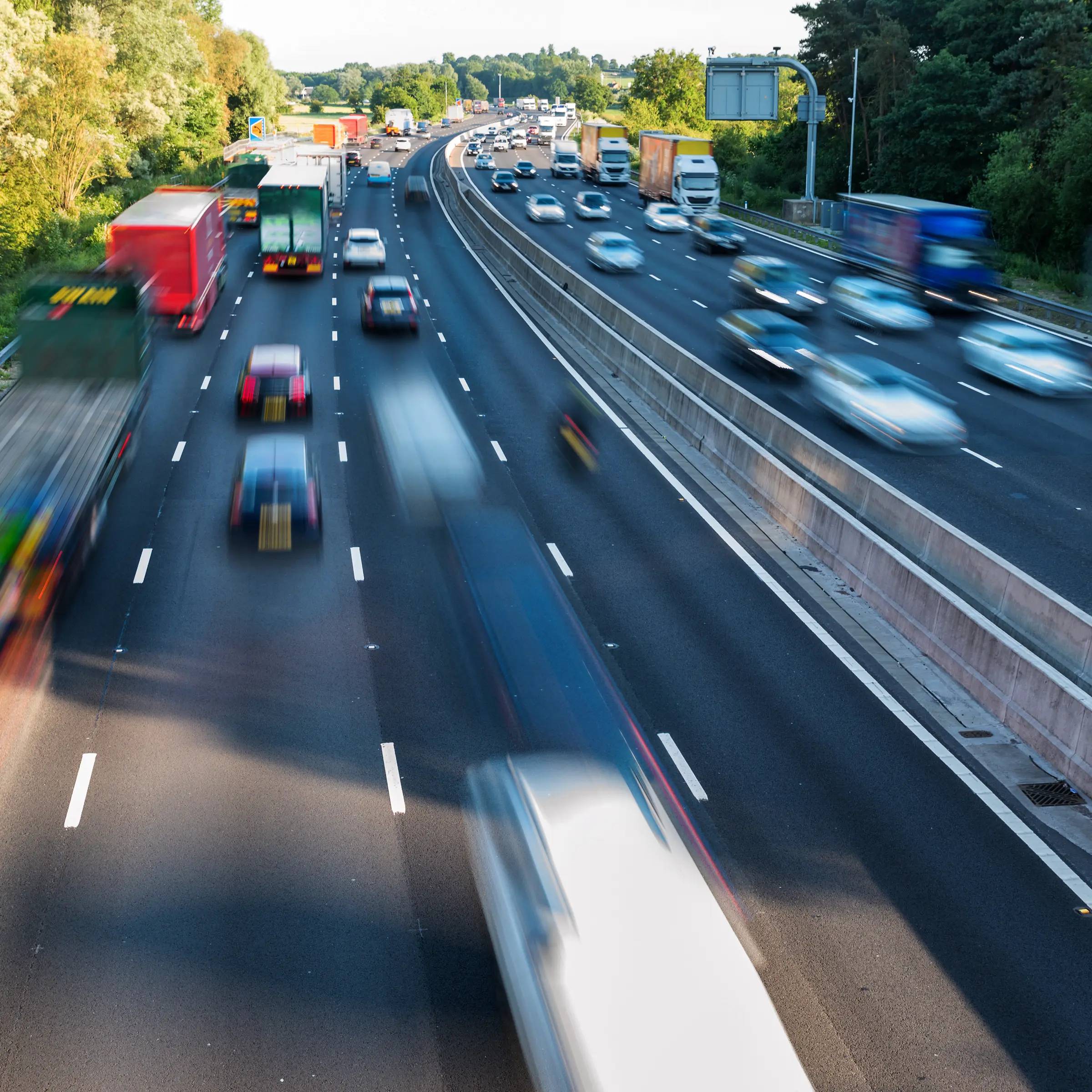 Motion blur photograph of cars and lorries driving on the motorway