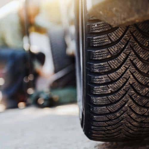 Photo of the back of a car tyre with the sun shining