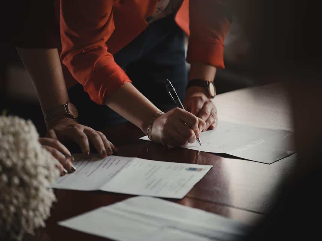 Person signing various documents