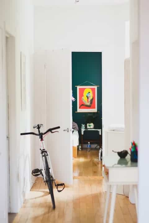 Bicycle leaning in a hallway