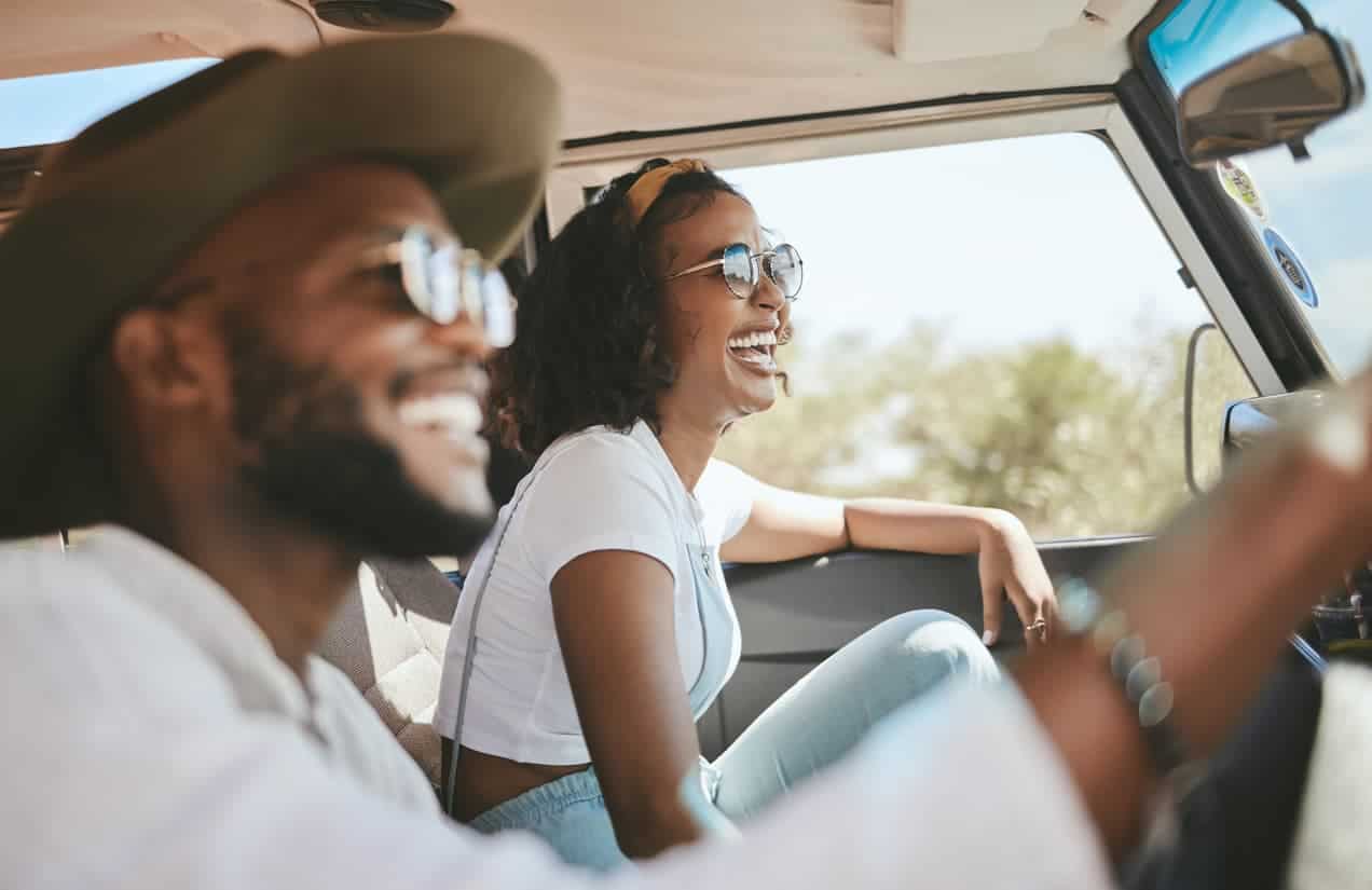 Travel, road trip and black people couple driving by countryside for holiday, journey and freedom with happiness