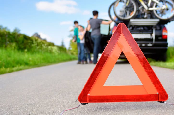 Car trouble hazard triangle on a highway