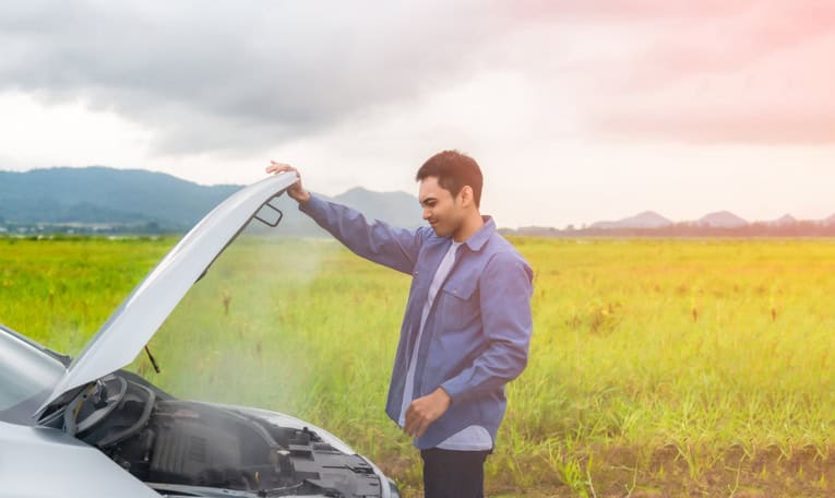 Asian young man having trouble car engine overheating and have smoke